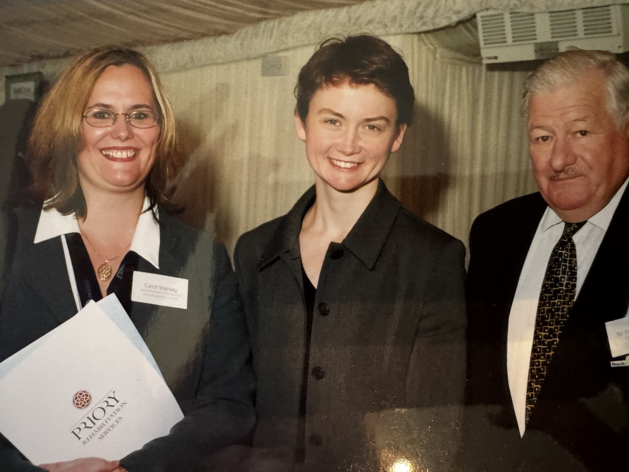 Carol Evans with an MP and a member of the House of Lords after speaking there